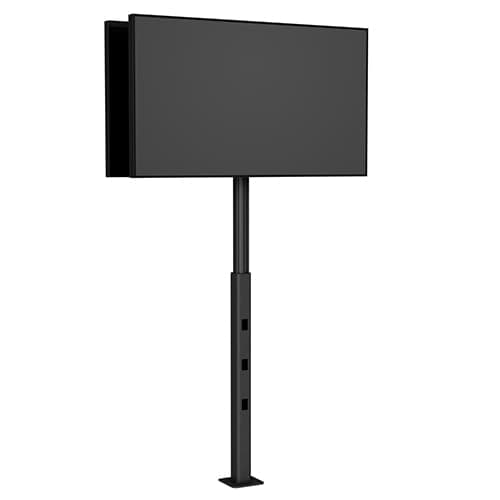 Chief PFB2UB bolt-down mount in black shown carrying a flat panel display on its slim floor-fixed column, viewed from the front three-quarter.