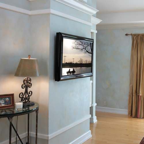 Room photograph of a flat panel display on a Chief PNR series swing arm wall mount. A lifestyle image for the PNR range rather than a studio shot of the PNRUB itself.