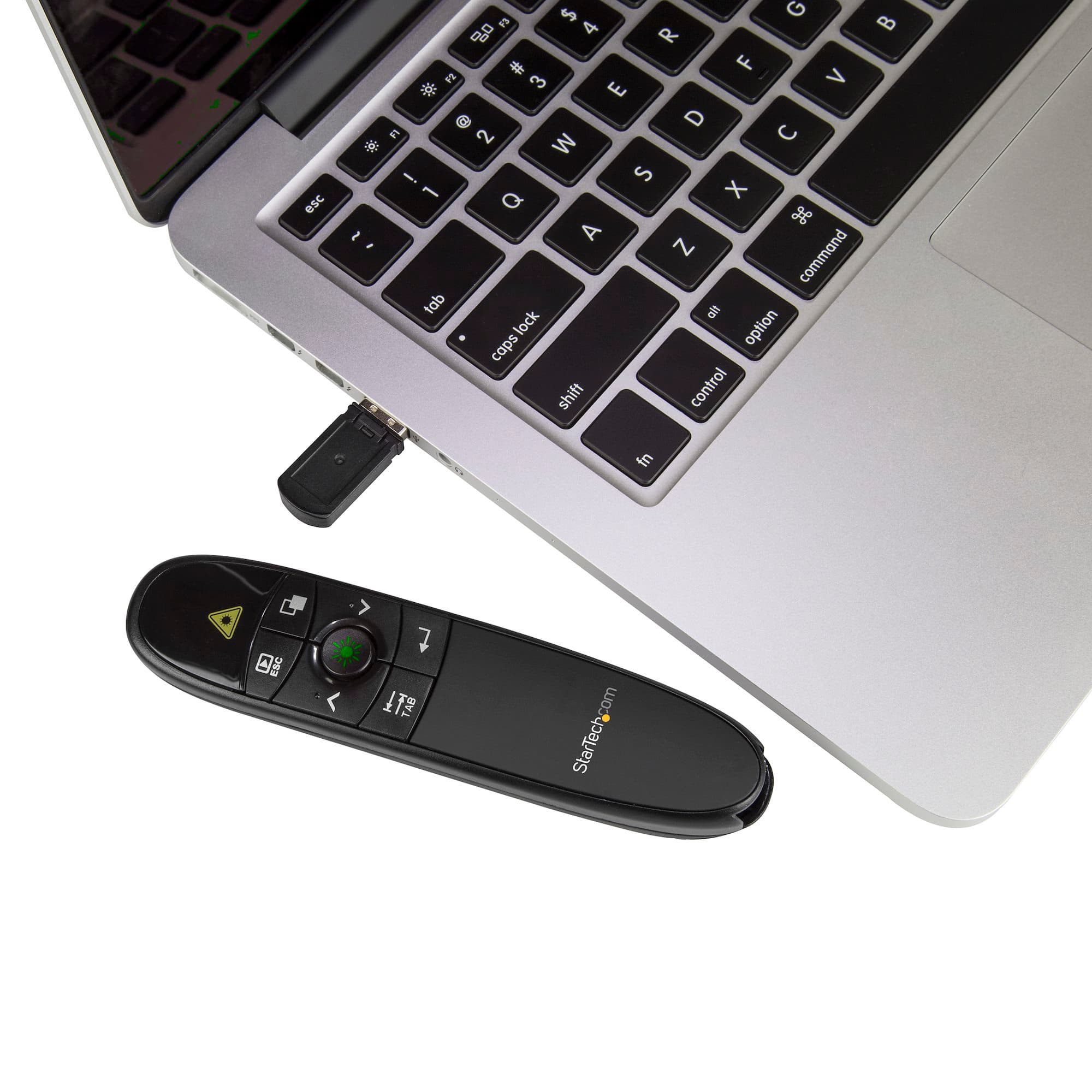 StarTech.com PRESREMOTEG Wireless Presentation Remote with Green Laser Pointer - USB receiver plugged into a laptop with the remote beside it