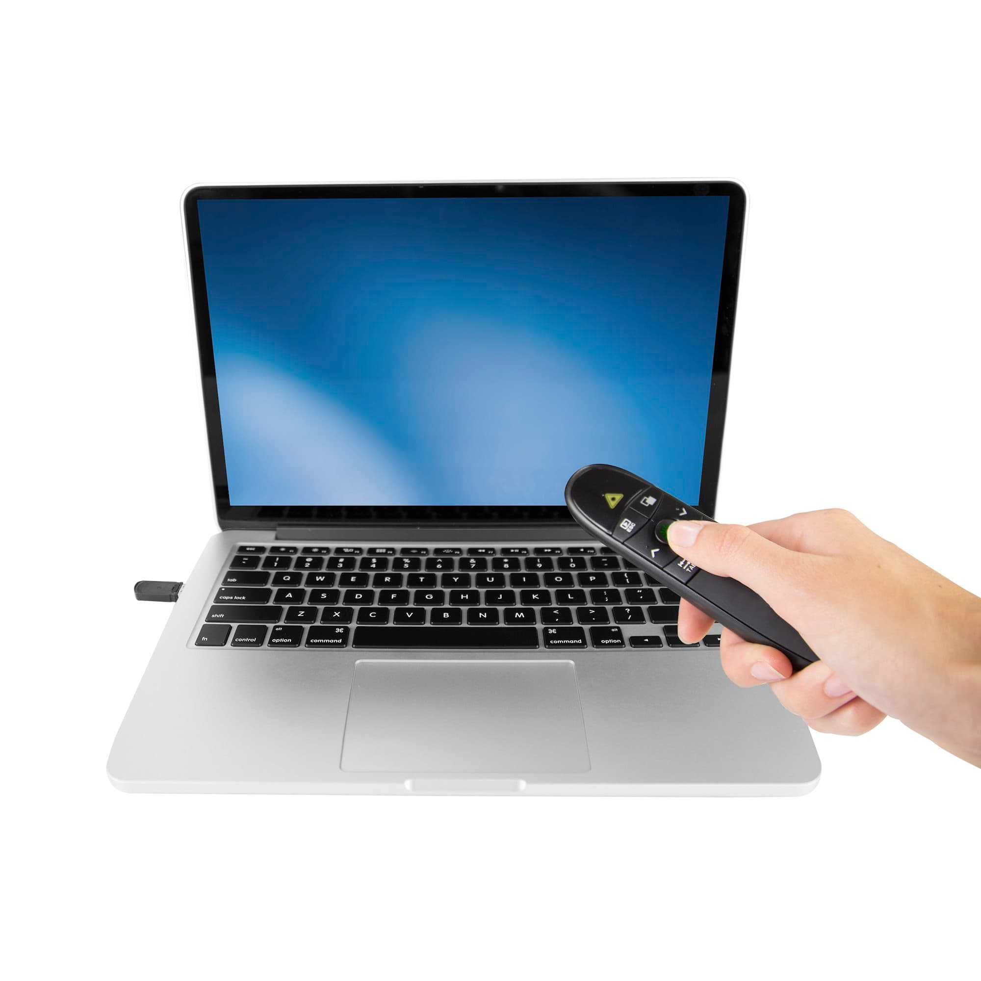 StarTech.com PRESREMOTEG Wireless Presentation Remote with Green Laser Pointer - the remote being held in front of a laptop in use