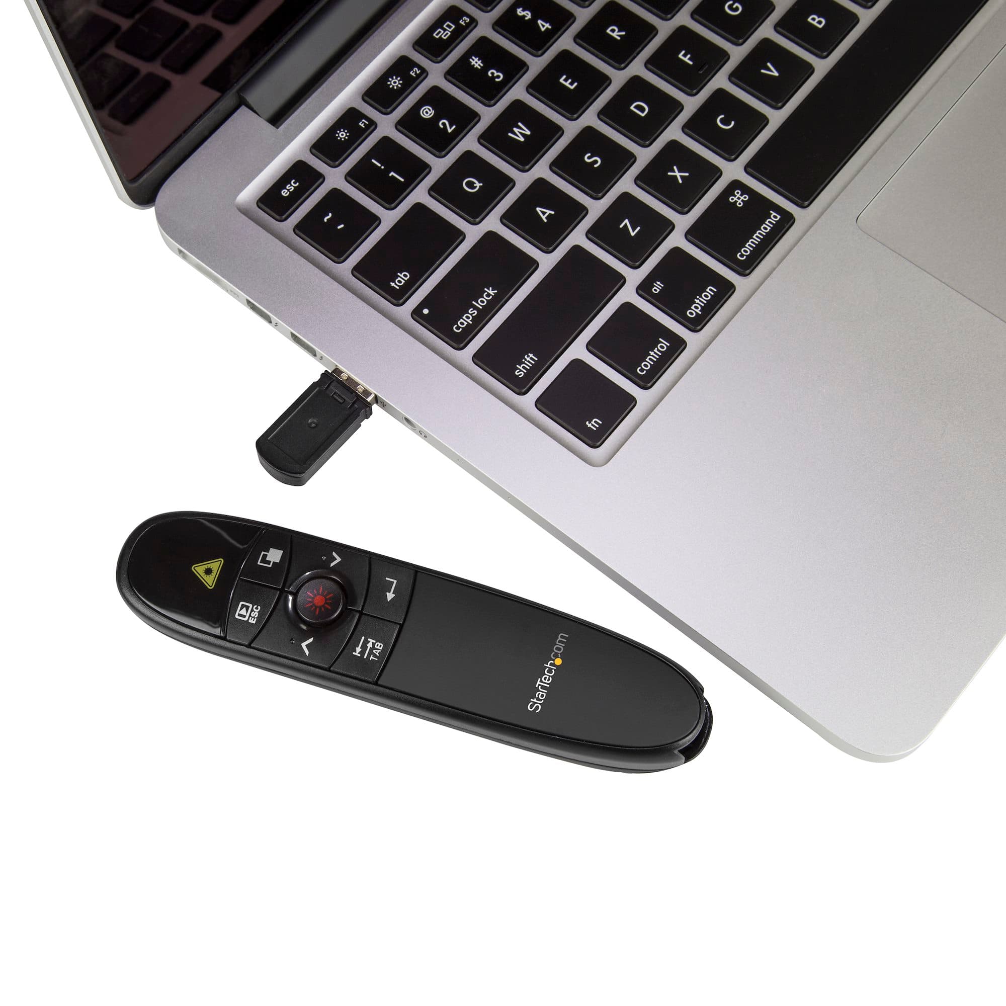 StarTech.com PRESREMOTE Wireless Presentation Remote with Red Laser Pointer - USB receiver plugged into a laptop with the remote beside it