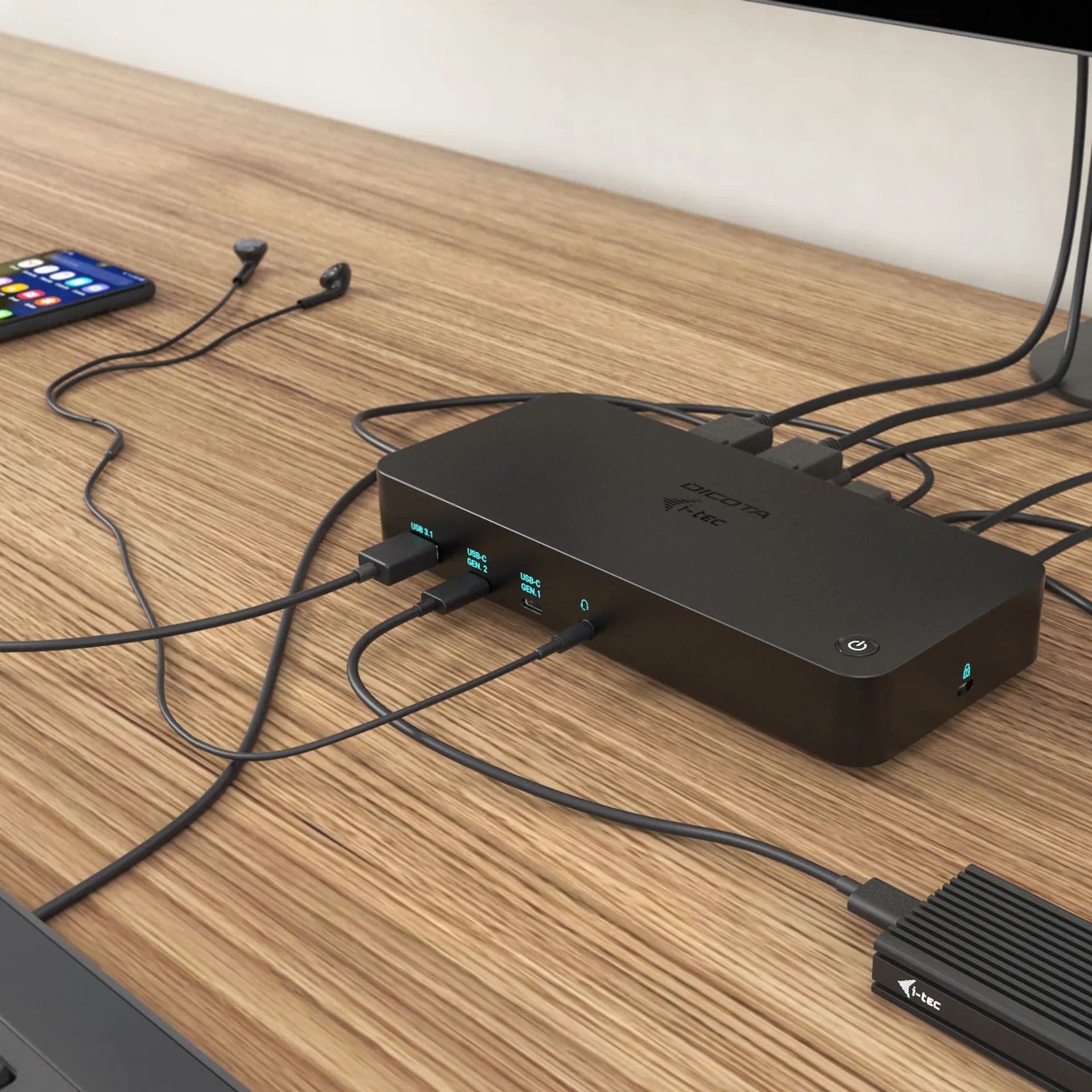 DICOTA D31951-UK USB-C 12-in-1 Docking Station 5K HDMI/DP PD 100W (UK) - the docking station in use on a desk with a laptop connected
