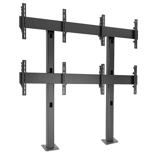 Chief LBM2X2U Fusion 2x2 landscape bolt-down video wall stand in black, shown empty, its columns ending in floor base plates.