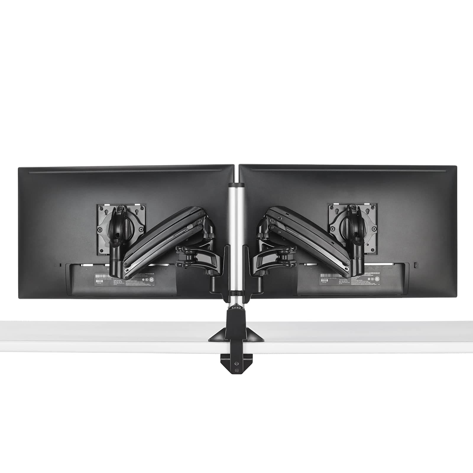 Chief KXC220B Kontour KX dual monitor column desk mount in black, clamped to a desk edge with two articulating arms and VESA heads fitted, no monitors attached.