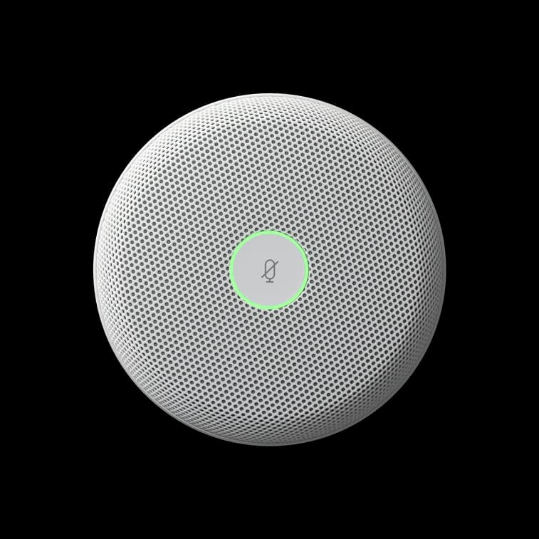Cisco Table Microphone Pro in First Light, top view with the mute ring lit green.